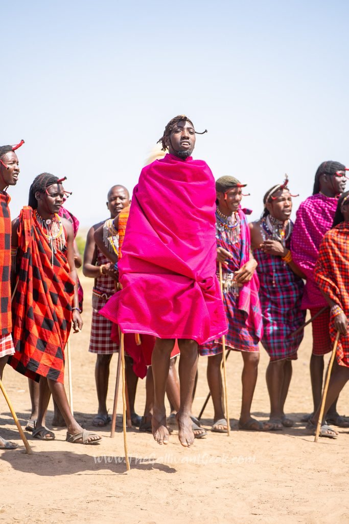 Maasai men singing a welcome song in a village near the Masai Mara