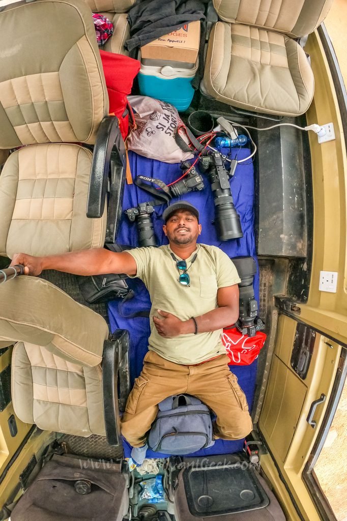 Safari vehicle packed with camera gear and a mattress for a Kenya photo safari