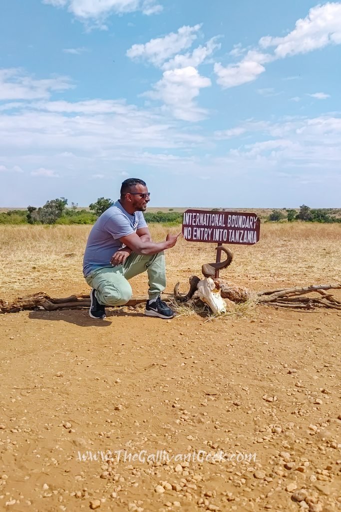 Kenya–Tanzania border marker inside the Masai Mara