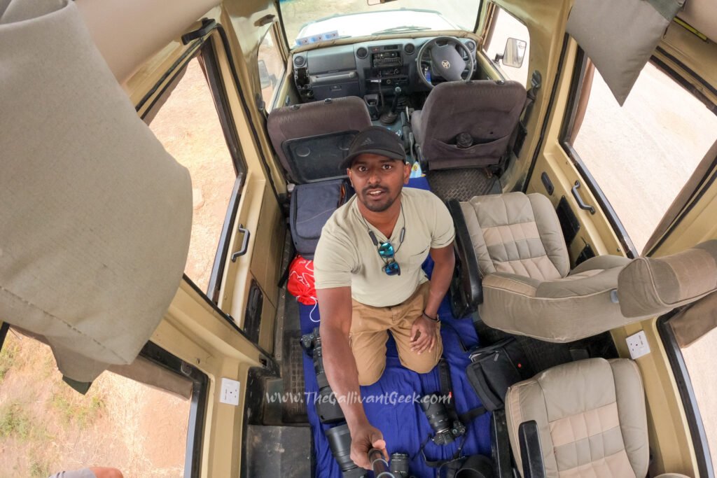 Sitting on a mattress on the floor of a safari vehicle, shot from above with a GoPro